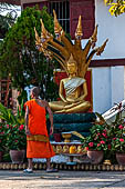 Luang Prabang, Laos - Wat Mai, Buddha statues inside the temple precinct. 